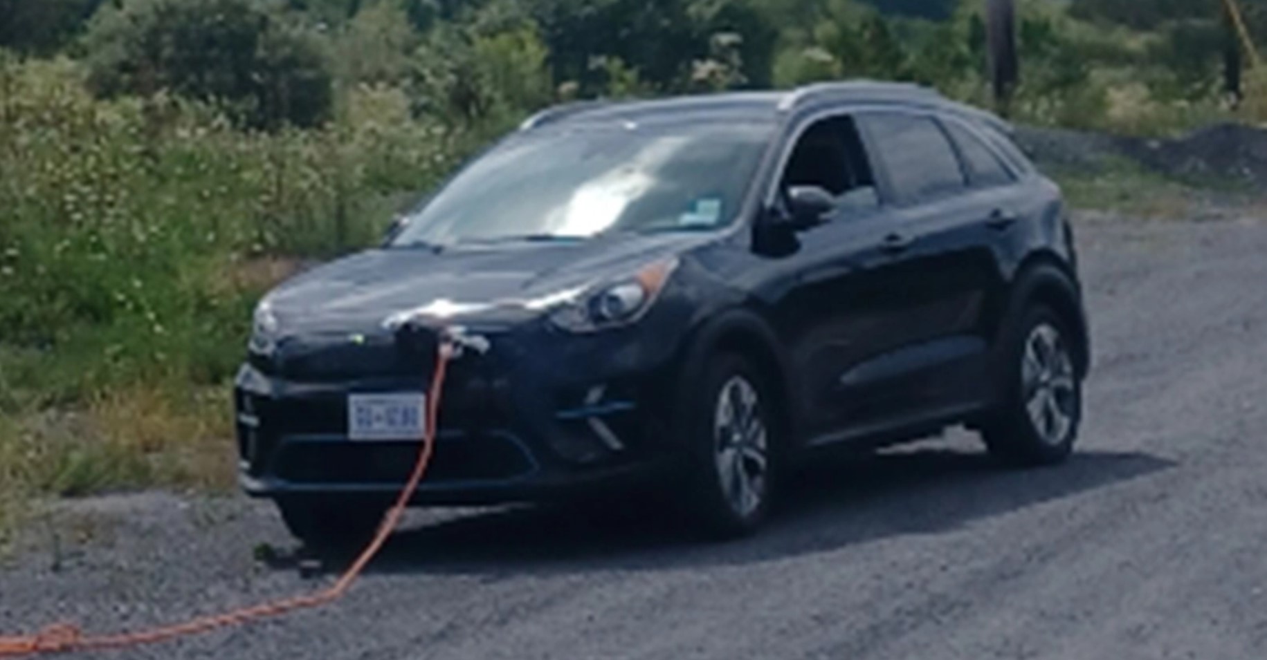 Coal miners pushing a stranded electric car Current Events Non